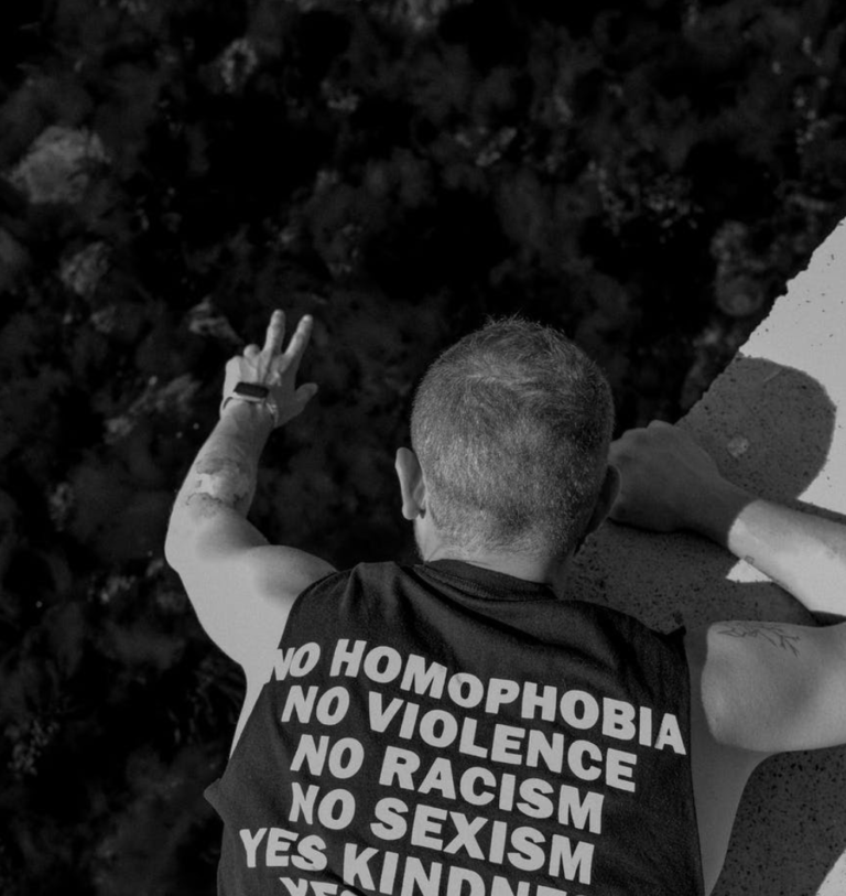 Two men beat up gay couple for kissing in front of their children.