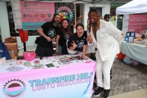 Transpire Help Volunteers with Xavier Clark at Transpire Help Booth Pride On The Block